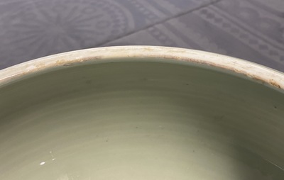 A Chinese celadon-glazed tripod censer with incised underglaze design, Kangxi